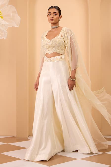 One Knot One By Ashna Ivory Crepe, Silk Embroidery Round , Open Blouse And Sharara Set at Aza Fashions One Knot One By Ashna_Ivory Crepe, Silk Embroidery Round , Open Blouse And Sharara Set _at_Aza_Fashions