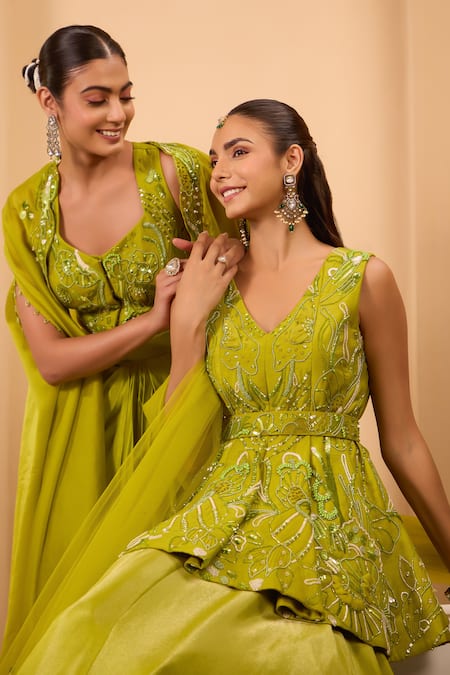 One Knot One By Ashna Green Tissue, Silk, Net Embroidery, Sequins V-neck Peplum Kurta Lehenga Set at Aza Fashions One Knot One By Ashna_Green Tissue, Silk, Net Embroidery, Sequins V-neck Peplum Kurta Lehenga Set _at_Aza_Fashions
