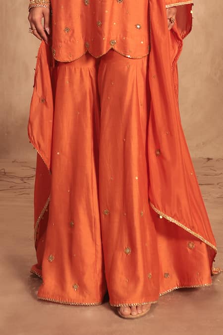 Label Niti Bothra Orange Silk Mirrors, Tassels Round Neck Embroidered Sharara Set Online at Aza Fashions Label Niti Bothra_Orange Silk Mirrors, Tassels Round Neck Embroidered Sharara Set _Online_at_Aza_Fashions