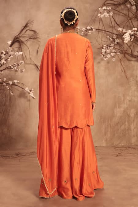 Shop Label Niti Bothra Orange Silk Mirrors, Tassels Round Neck Embroidered Sharara Set at Aza Fashions Shop_Label Niti Bothra_Orange Silk Mirrors, Tassels Round Neck Embroidered Sharara Set _at_Aza_Fashions