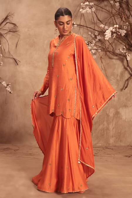 Label Niti Bothra Orange Silk Mirrors, Tassels Round Neck Embroidered Sharara Set at Aza Fashions Label Niti Bothra_Orange Silk Mirrors, Tassels Round Neck Embroidered Sharara Set _at_Aza_Fashions