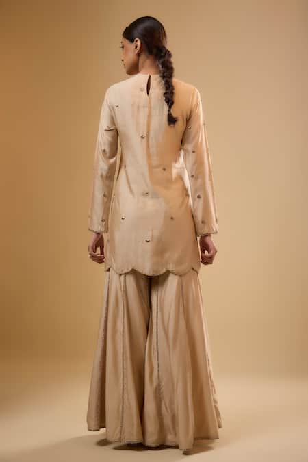 Shop Label Niti Bothra Ivory Silk, Chinon Zari, Embroidery, Tassels, Gota Patti Round Neck Sharara Set at Aza Fashions Shop_Label Niti Bothra_Ivory Silk, Chinon Zari, Embroidery, Tassels, Gota Patti Round Neck Sharara Set _at_Aza_Fashions