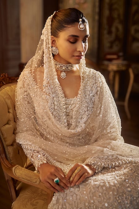 Shop_Seema Gujral_Ivory Net Embroidery, Pearls, Sequins, Crystals, Tassels Vinatge Lehenga Set _Online_at_Aza_Fashions
