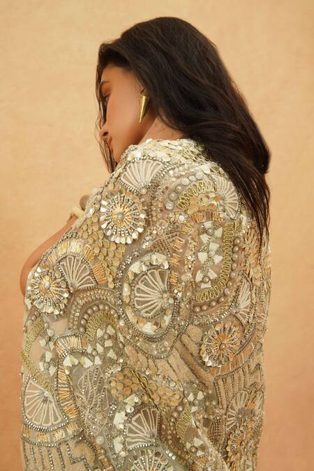 Sva By Sonam & Paras Modi Ivory Silk, Crepe, Organza Sequins, Beads Embellished Cape And Drape Skirt Set at Aza Fashions Sva By Sonam & Paras Modi_Ivory Silk, Crepe, Organza Sequins, Beads Embellished Cape And Drape Skirt Set_at_Aza_Fashions