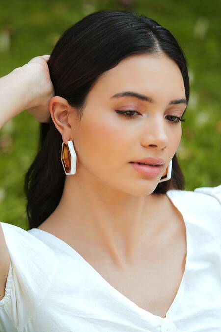 Varnika Arora_Gold Plated Devine White Enamel Earrings _Online_at_Aza_Fashions