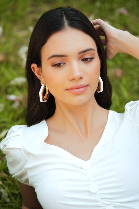 Shop_Varnika Arora_Gold Plated Devine White Enamel Earrings _Online_at_Aza_Fashions