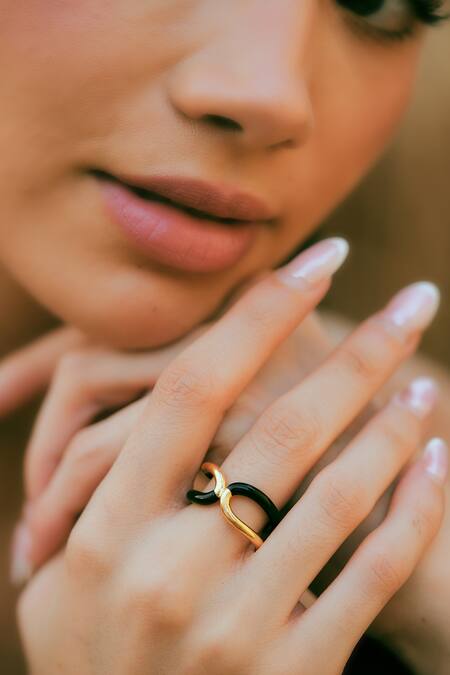 Varnika Arora_Gold Plated Twistie 2-way Black Enamel Ring _at_Aza_Fashions