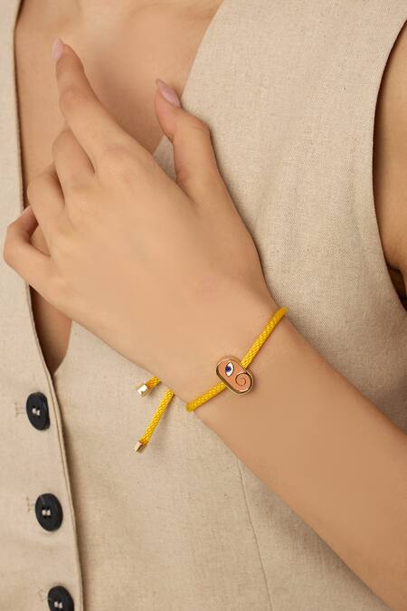 Shop Isharya Yellow Embroidery Ganesha Rakhi Bracelet Online at Aza Fashions Shop_Isharya_Yellow Embroidery Ganesha Rakhi Bracelet _Online_at_Aza_Fashions