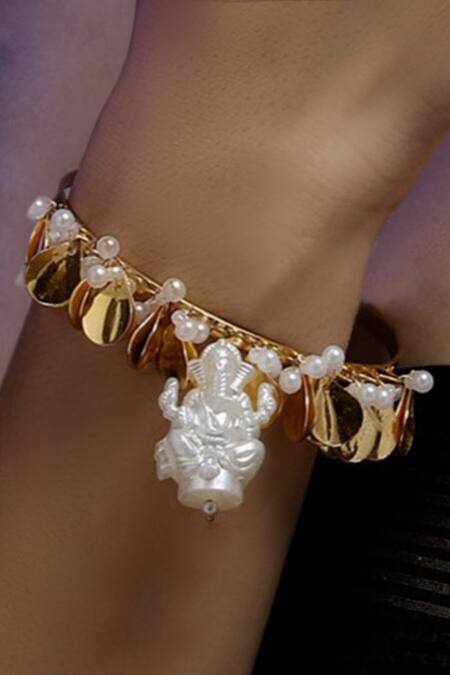 Shop Dugran By Dugristyle Gold Plated Pearls, Chains Zard Khushi Bracelet at Aza Fashions Shop_Dugran By Dugristyle_Gold Plated Pearls, Chains Zard Khushi Bracelet _at_Aza_Fashions