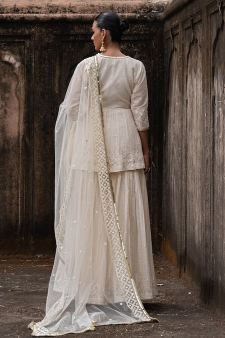 Shop Preevin Off White Shantoon, Tulle Sequins, Golden Forest Peplum Kurta Sharara Set at Aza Fashions Shop_Preevin_Off White Shantoon, Tulle Sequins, Golden Forest Peplum Kurta Sharara Set _at_Aza_Fashions