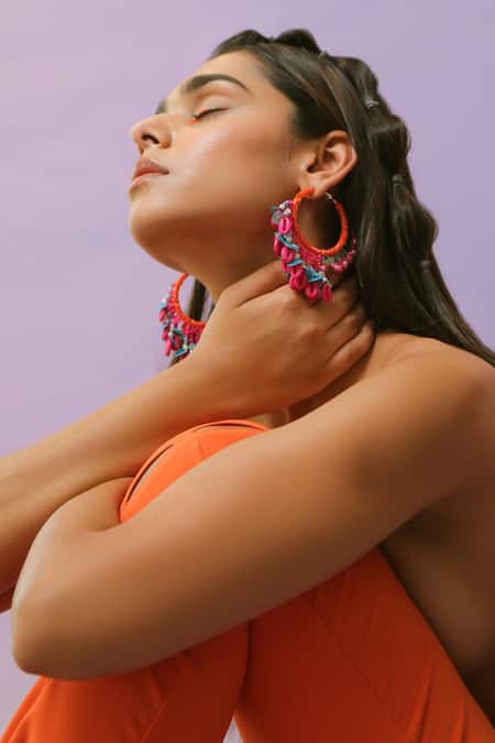 Shop NAKHREWAALI Pink Beads, Tassels Shararat Beaded Asymmetric Hoop Earrings at Aza Fashions Shop_NAKHREWAALI_Pink Beads, Tassels Shararat Beaded Asymmetric Hoop Earrings _at_Aza_Fashions