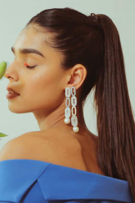 Shop NAKHREWAALI White Embroidery Glow Up Long Pearl Drop Earrings at Aza Fashions Shop_NAKHREWAALI_White Embroidery Glow Up Long Pearl Drop Earrings _at_Aza_Fashions