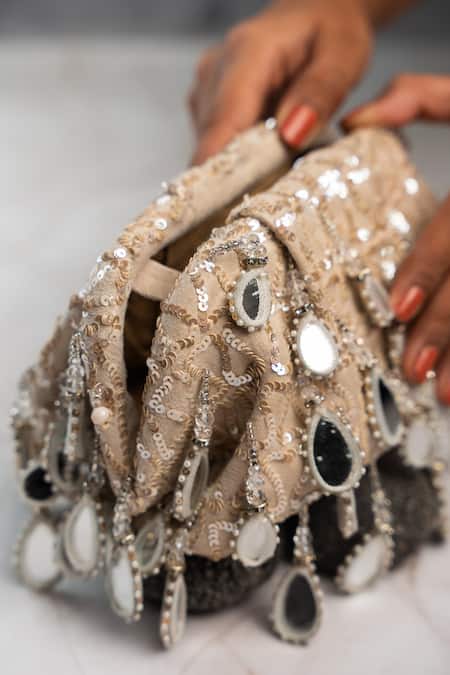 Shop Nayaab By Sonia Off White Embroidery, Sequins Aaina Aynali Frame Ecru Potli Clutch at Aza Fashions Shop_Nayaab By Sonia_Off White Embroidery, Sequins Aaina Aynali Frame Ecru Potli Clutch _at_Aza_Fashions