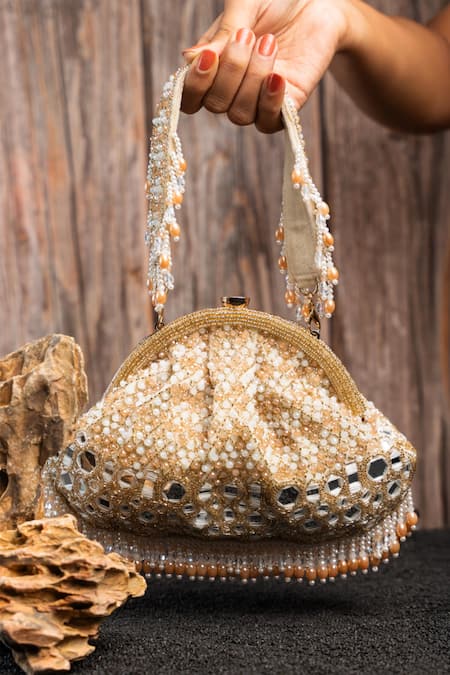 Shop Nayaab By Sonia Gold Beads, Embroidery, Sequins Aynali Clutch Ecru Potli at Aza Fashions Shop_Nayaab By Sonia_Gold Beads, Embroidery, Sequins Aynali Clutch Ecru Potli _at_Aza_Fashions