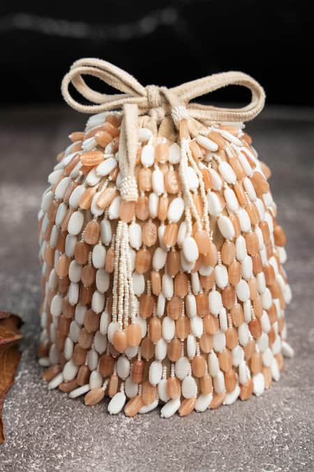 Shop Nayaab By Sonia Cream Beads Serenity Gilt Drops Rustic Aura Potli at Aza Fashions Shop_Nayaab By Sonia_Cream Beads Serenity Gilt Drops Rustic Aura Potli _at_Aza_Fashions