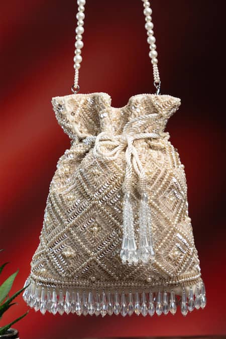 Buy Nayaab By Sonia Off White Pearls, Rhinestones, Embroidery, Crystals Criss Cross Ivory Potli Online at Aza Fashions Buy_Nayaab By Sonia_Off White Pearls, Rhinestones, Embroidery, Crystals Criss Cross Ivory Potli _Online_at_Aza_Fashions