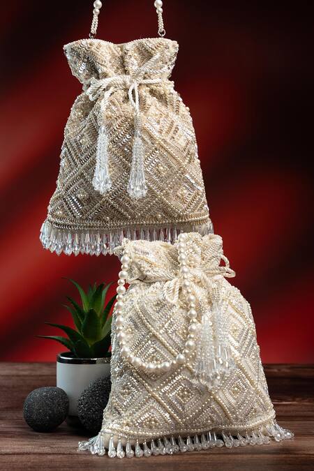 Nayaab By Sonia Off White Pearls, Rhinestones, Embroidery, Crystals Criss Cross Ivory Potli at Aza Fashions Nayaab By Sonia_Off White Pearls, Rhinestones, Embroidery, Crystals Criss Cross Ivory Potli _at_Aza_Fashions