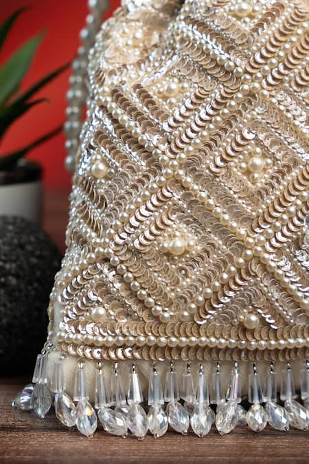 Buy Nayaab By Sonia Off White Pearls, Rhinestones, Embroidery, Crystals Criss Cross Ivory Potli Buy_Nayaab By Sonia_Off White Pearls, Rhinestones, Embroidery, Crystals Criss Cross Ivory Potli