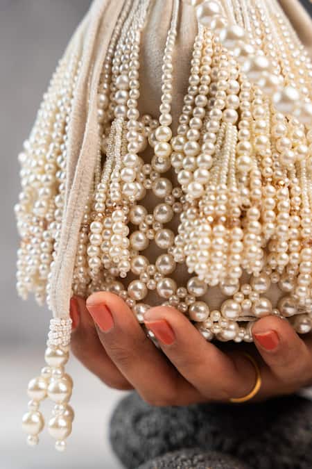 Buy_Nayaab By Sonia_White Pearls Raindrops Tassel Potli _Online_at_Aza_Fashions