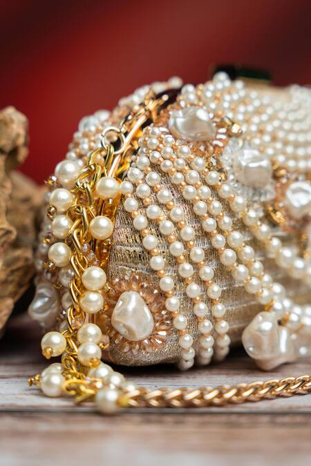 Nayaab By Sonia Cream Pearls Adorn Kasse Gold Clutch at Aza Fashions Nayaab By Sonia_Cream Pearls Adorn Kasse Gold Clutch _at_Aza_Fashions