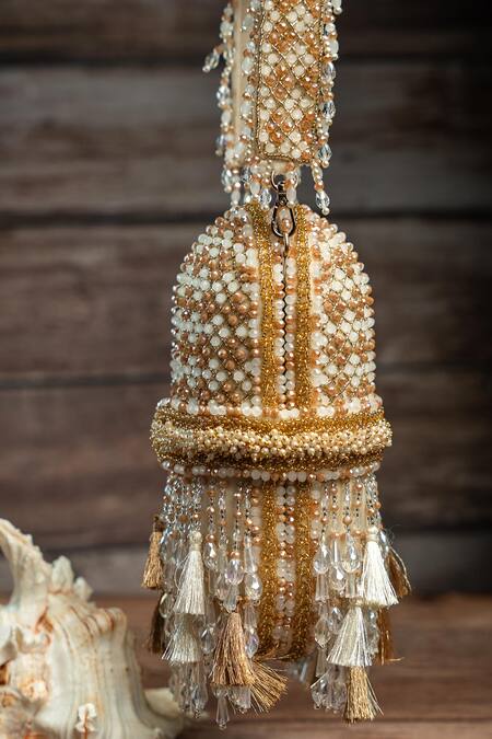 Nayaab By Sonia_Cream Beads, Tassels, Embroidery Damsel Criss Cross Ecru Potli _Online_at_Aza_Fashions