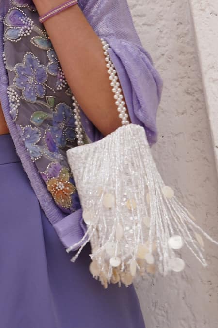 Buy_Plode_White Cut Work, Sequins Cutdana Tassel Embellished Potli _Online_at_Aza_Fashions