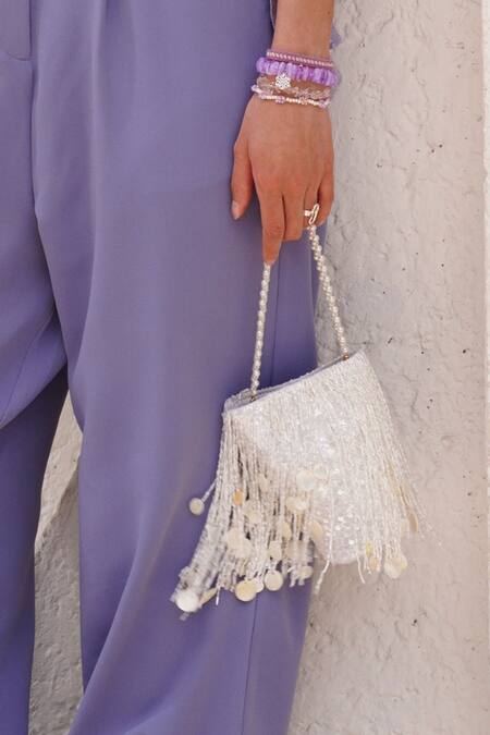 Shop_Plode_White Cut Work, Sequins Cutdana Tassel Embellished Potli _Online_at_Aza_Fashions