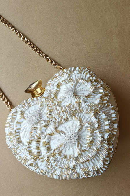 Plode_White Beads, Cut Work Hand Embellished Heart Clutch With Sling _Online_at_Aza_Fashions
