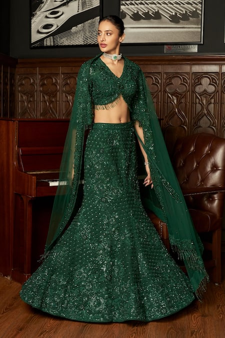 Istya Emerald Green Net Sequins, Embroidery V-neck Fishcut Lehenga Set at Aza Fashions Istya_Emerald Green Net Sequins, Embroidery V-neck Fishcut Lehenga Set _at_Aza_Fashions