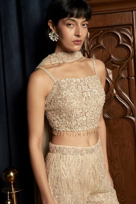 Istya_Beige Net Sequins, Beads, Embroidery Embellished Sharara Set _at_Aza_Fashions