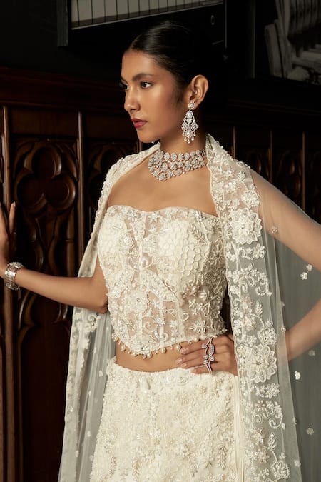 Buy_Istya_Ivory Net Sequins, Embroidery Embellished Fish Cut Lehenga Set _Online_at_Aza_Fashions