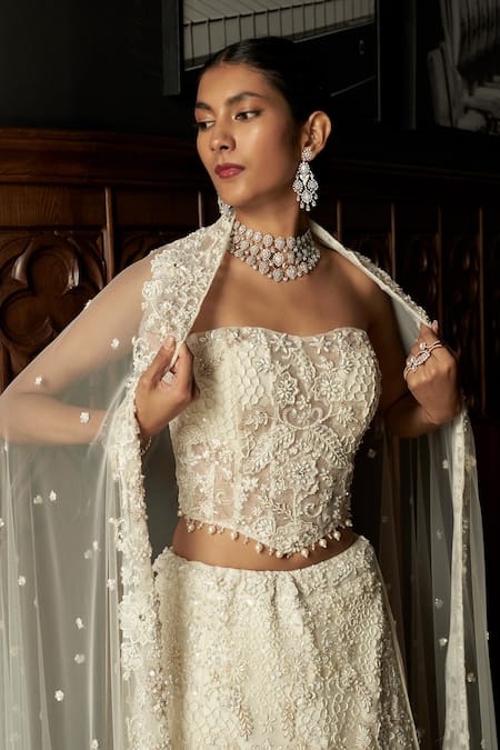 Istya_Ivory Net Sequins, Embroidery Embellished Fish Cut Lehenga Set _at_Aza_Fashions
