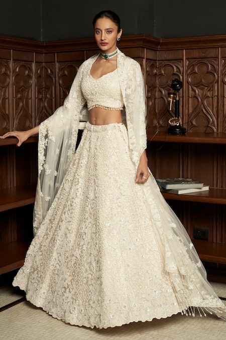 Buy Istya Ivory Net Sequins, Pearls, Beads, Embroidery Sweetheart Embellished Lehenga Set Online at Aza Fashions Buy_Istya_Ivory Net Sequins, Pearls, Beads, Embroidery Sweetheart Embellished Lehenga Set _Online_at_Aza_Fashions