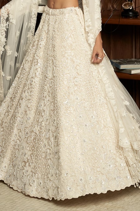 Shop Istya Ivory Net Sequins, Pearls, Beads, Embroidery Sweetheart Embellished Lehenga Set Online at Aza Fashions Shop_Istya_Ivory Net Sequins, Pearls, Beads, Embroidery Sweetheart Embellished Lehenga Set _Online_at_Aza_Fashions
