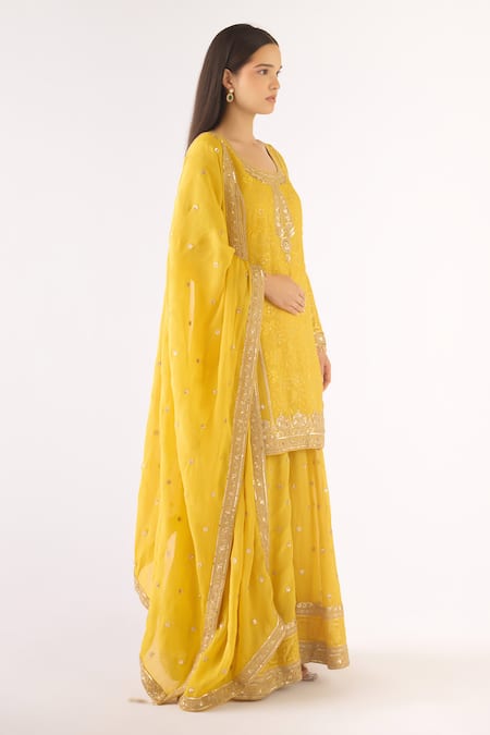 Basanti - Kapde Aur Koffee Yellow Brocade Sequins, Zari, Embroidery Round Neck Banarasi Sharara Set Online at Aza Fashions Basanti - Kapde Aur Koffee_Yellow Brocade Sequins, Zari, Embroidery Round Neck Banarasi Sharara Set_Online_at_Aza_Fashions