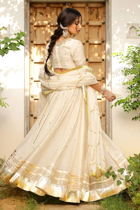 Shop_Sanam_Ivory Chanderi Mirrors, Zari, Gota Patti V-neck Embroidered Lehenga Set _Online_at_Aza_Fashions