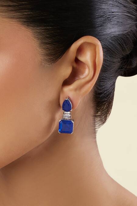 Shop Isharya Blue Crystals Sapphire Radiance Rhodium Plated Dangle Earrings Online at Aza Fashions Shop_Isharya_Blue Crystals Sapphire Radiance Rhodium Plated Dangle Earrings_Online_at_Aza_Fashions