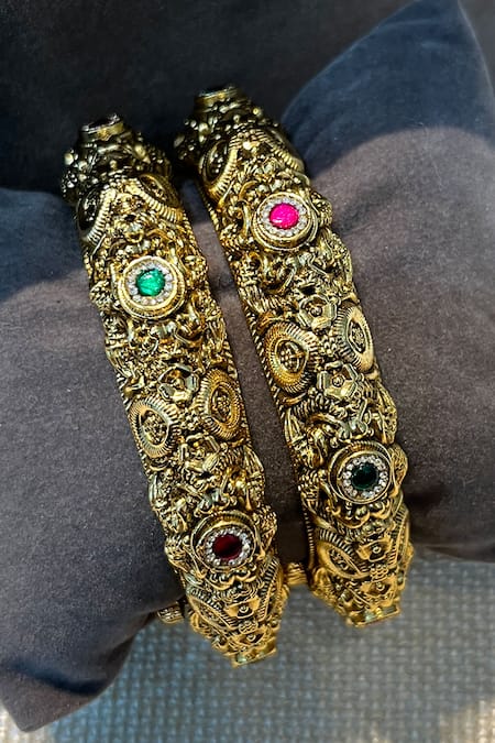 Prestones_Red Imitation Gemstones Temple Carved Bangles - Set Of 2 _at_Aza_Fashions
