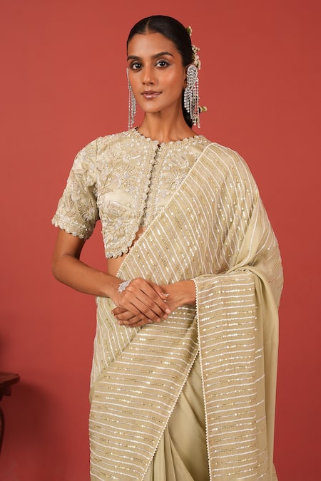 Suruchi Parakh_Green Crepe, Tissue Sequins, Embroidery Round Neck Cutwork Blouse With Saree _at_Aza_Fashions
