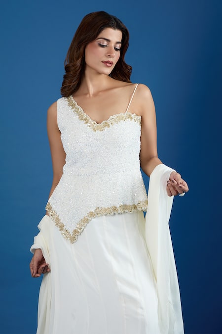 Samyukta Singhania_White Chinon Sequins Asymmetric Embroidered Blouse And Skirt Set _at_Aza_Fashions