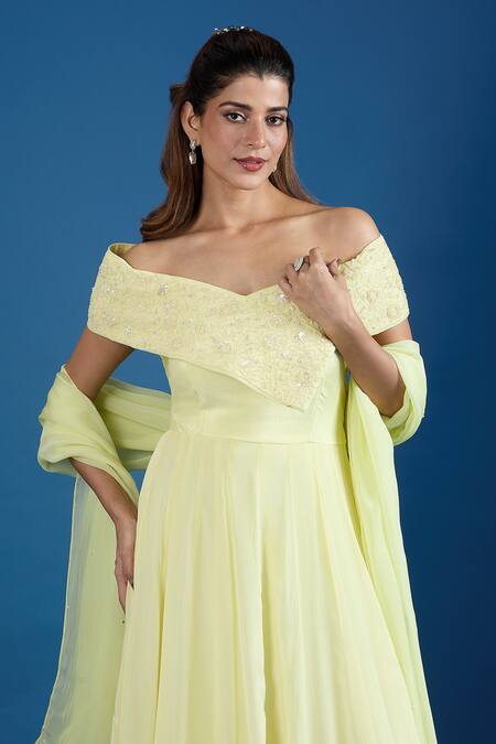 Samyukta Singhania_Yellow Chinon Cut Work, Sequins Off-shoulder Asymmetric Embroidered Gown _at_Aza_Fashions