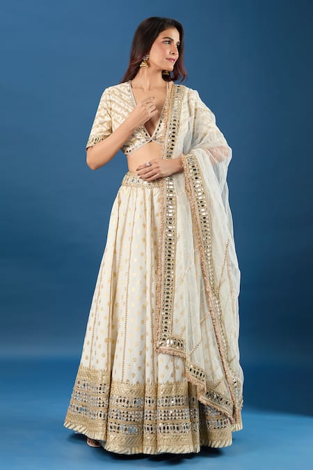 Buy Samyukta Singhania Off White Brocade, Net Mirrors, Sequins V-neck Work Lehenga Set Online at Aza Fashions Buy_Samyukta Singhania_Off White Brocade, Net Mirrors, Sequins V-neck Work Lehenga Set _Online_at_Aza_Fashions