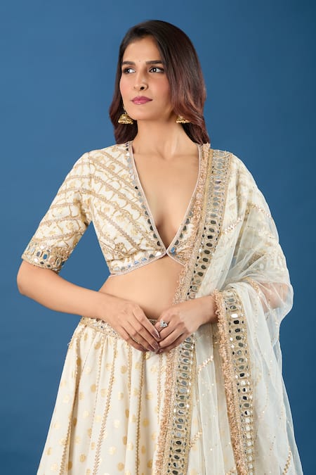 Samyukta Singhania Off White Brocade, Net Mirrors, Sequins V-neck Work Lehenga Set at Aza Fashions Samyukta Singhania_Off White Brocade, Net Mirrors, Sequins V-neck Work Lehenga Set _at_Aza_Fashions