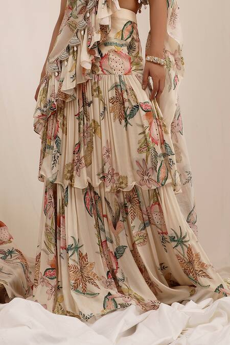 Surkh Syahi Beige Chinon V-neck Madhaniya Draped Saree With Blouse at Aza Fashions Surkh Syahi_Beige Chinon V-neck Madhaniya Draped Saree With Blouse _at_Aza_Fashions