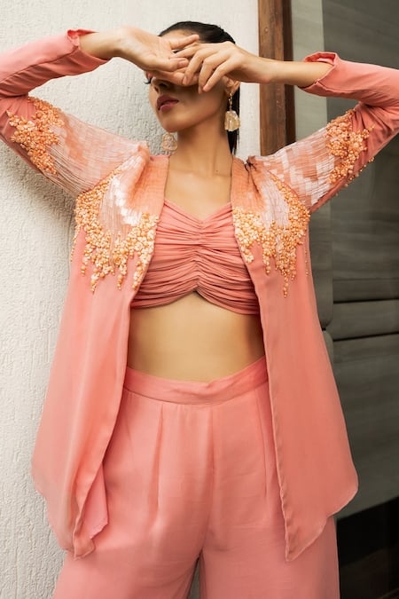 Shop Richa Jaisinghani Label Peach Georgette And Net Thread Work, Beads V Embroidered Jacket & Flared Pant Set at Aza Fashions Shop_Richa Jaisinghani Label_Peach Georgette And Net Thread Work, Beads V Embroidered Jacket & Flared Pant Set _at_Aza_Fashions