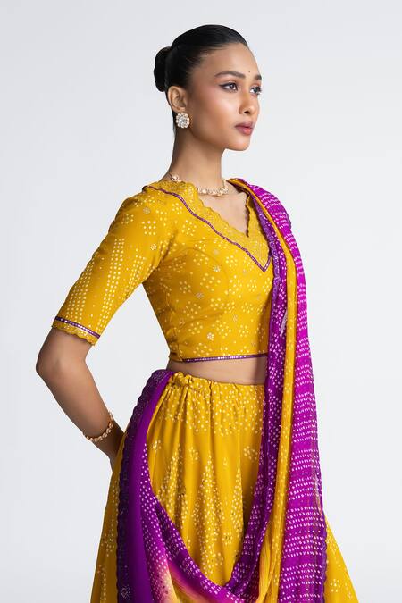 Naina Jain_Yellow Crepe, Chiffon Mirrors V-neck Bandhani Lehenga Set _Online_at_Aza_Fashions