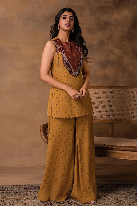 Shop_ISHA GUPTA TAYAL_Mustard Crepe Embroidery Round Neck Gold Peplum Top And Pant Set _Online_at_Aza_Fashions
