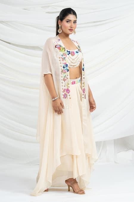 Ellemora Fashions Off White Viscose Georgette Embroidery, Beads, Tassels, Sequins Shrug Skirt Set at Aza Fashions Ellemora Fashions_Off White Viscose Georgette Embroidery, Beads, Tassels, Sequins Shrug Skirt Set _at_Aza_Fashions