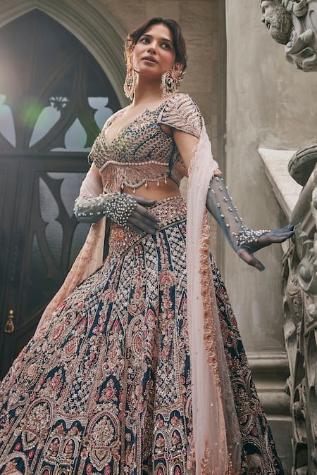 Shop Jigar & Nikita Blue Velvet, Net Embroidery, Zari, Beads, Tassels Neel Kamdhenu Lehenga Set Online at Aza Fashions Shop_Jigar & Nikita_Blue Velvet, Net Embroidery, Zari, Beads, Tassels Neel Kamdhenu Lehenga Set _Online_at_Aza_Fashions