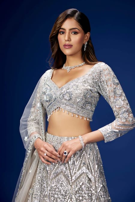 Opus Atelier Silver Net, Tulle Sequins, Embroidery V-neck Zephyr Lehenga Set Online at Aza Fashions Opus Atelier_Silver Net, Tulle Sequins, Embroidery V-neck Zephyr Lehenga Set _Online_at_Aza_Fashions